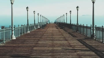 Light lined pier over water