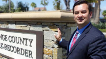 Hugh in front of sign