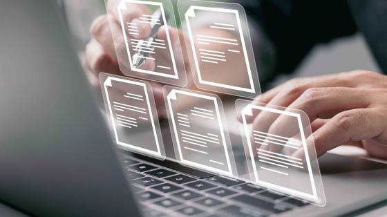 Computer image with electronic documents floating over keyboard