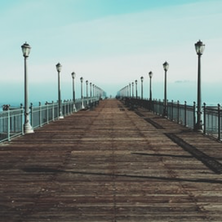 Light lined pier over water